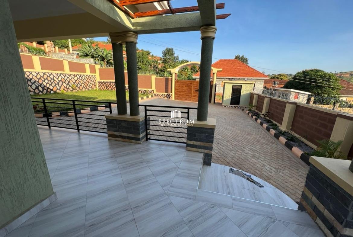 This bungalow house for sale in Akright Estate Bwebajja Kampala