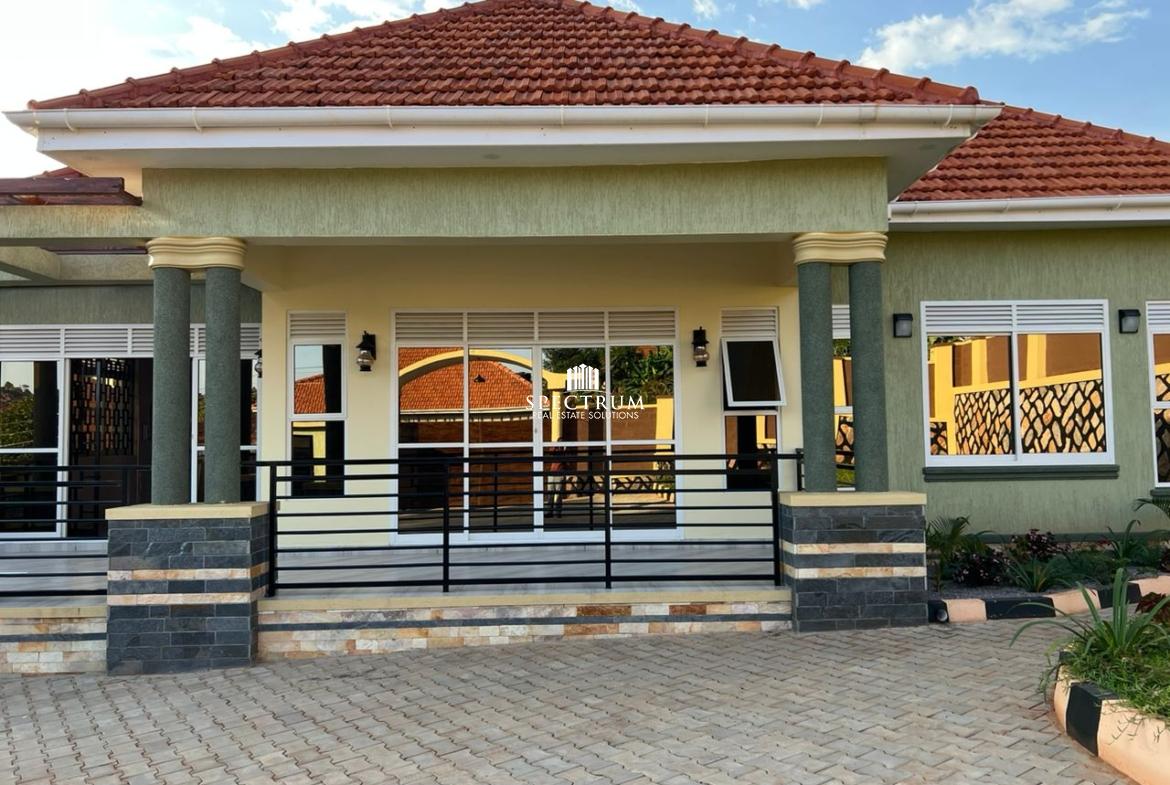 This bungalow house for sale in Akright Estate Bwebajja Kampala